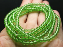 Load image into Gallery viewer, Green Andara Crystal Infinity Necklace