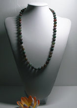 Load image into Gallery viewer, a close up of a baseball glove with a ball in it