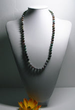 Load image into Gallery viewer, a baseball mitt with a ball in it