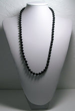 Load image into Gallery viewer, a baseball glove with a baseball inside of it