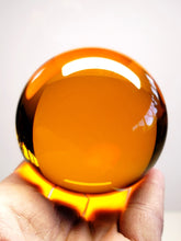 Load image into Gallery viewer, Amber Light / Golden Orange Andara Crystal Sphere 2.75inch
